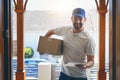 Happy delivery man, box and portrait in logistics, parcel or courier service with tablet at front door. Male person Royalty Free Stock Photo