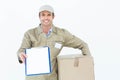 Happy delivery man with box showing clipboard Royalty Free Stock Photo