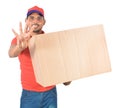Happy delivery man carrying carton boxes whowing four fingers in Royalty Free Stock Photo