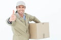 Happy delivery man gesturing thumbs up while carrying box Royalty Free Stock Photo