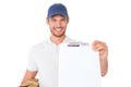 Happy delivery man holding cardboard box and clipboard