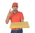 Happy delivery man holding gift pack ,victory sign in uniform Royalty Free Stock Photo