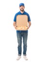 happy delivery man holding pizza in box and smiling at camera Royalty Free Stock Photo