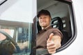 Happy Delivery Man Sitting Inside Van Royalty Free Stock Photo