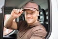 Happy Delivery Man Sitting Inside Van Royalty Free Stock Photo