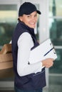 happy delivery woman with clipboard