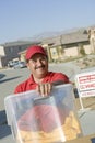 Happy Deliveryman Carrying Container