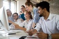 Happy designer people working together at desk on computer in office Royalty Free Stock Photo