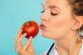 Happy dietitian nutritionist with apple fruit.