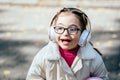 Happy disability kid outdoor portrait..time to use headphones.