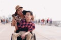 Happy disability kid travel in family holiday concept