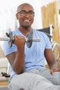 Happy disable man with dumbbells