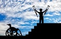 Happy disabled boy standing on sters with crutches in his hands and wheelchair Royalty Free Stock Photo