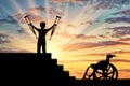 Happy disabled boy standing on sters with crutches in his hands and wheelchair Royalty Free Stock Photo