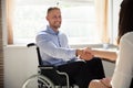 Disabled Businessman Shaking Hand With His Partner
