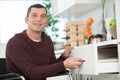 happy disabled man preparing soup at kitchen Royalty Free Stock Photo