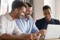 Happy diverse business men team laughing looking at laptop Royalty Free Stock Photo