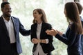 Happy diverse business team applauding coworker success