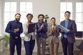 Happy diverse business team applauding their coworker after a presentation at a work meeting Royalty Free Stock Photo