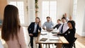 Happy diverse business team voting on presentation, raising hands Royalty Free Stock Photo