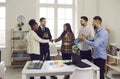 Happy diverse business teams making a deal and shaking hands in an office meeting Royalty Free Stock Photo