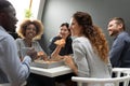 Happy diverse colleagues having fun, enjoying pizza in office Royalty Free Stock Photo