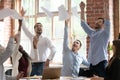 Happy diverse colleagues throw papers celebrating success Royalty Free Stock Photo