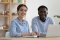 Happy diverse company mentor and intern working in office Royalty Free Stock Photo