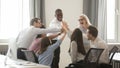 Happy diverse employees business team engaged in teambuilding giving high-five Royalty Free Stock Photo