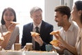 Happy diverse employees colleagues sharing meal at lunch break Royalty Free Stock Photo