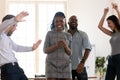 Happy diverse employees dance celebrating success in office Royalty Free Stock Photo