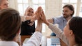 Happy diverse employees team giving high five close up Royalty Free Stock Photo