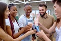 Happy diverse friends cheering with lemonade at barbecue dinner party Royalty Free Stock Photo