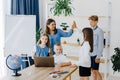 Portrait of children and teacher looking at laptop in the classroom Royalty Free Stock Photo