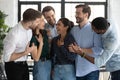 Happy diverse millennial friends greeting indian female mate with achievement Royalty Free Stock Photo