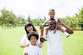 Happy diverse and mixed race family group photo in the park