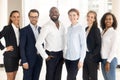 Happy diverse and multiracial employees group looking at camera.