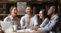 Happy diverse students team studying together sit at cafe table Royalty Free Stock Photo