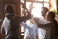 Happy diverse friends giving high five engaged in multicultural friendship Royalty Free Stock Photo