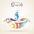 Happy Diwali celebration with colourful lit lamp.