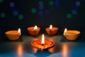 Happy Diwali - Clay Diya lamps lit during Dipavali Royalty Free Stock Photo