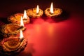 Happy Diwali - Clay Diya lamps lit during Dipavali Royalty Free Stock Photo