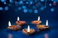 Happy Diwali - Clay Diya lamps lit during Dipavali Royalty Free Stock Photo