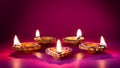 Happy Diwali - Clay Diya lamps lit during Dipavali, Hindu festival of lights celebration