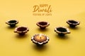 Happy Diwali - Clay Diya lamps lit during Dipavali, Hindu festival of lights celebration. Colorful traditional oil lamp diya Royalty Free Stock Photo