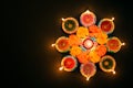 Happy Diwali - Clay Diya lamps lit during Dipavali, Hindu festival of lights celebration. Colorful traditional oil lamp diya on Royalty Free Stock Photo