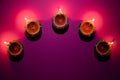 Happy Diwali - Clay Diya lamps lit during Dipavali, Hindu festival of lights celebration. Colorful traditional oil lamp diya on