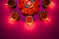 Happy Diwali - Clay Diya lamps lit during Dipavali, Hindu festival of lights celebration. Colorful traditional oil lamp diya on