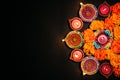 Happy Diwali - Clay Diya lamps lit during Dipavali, Hindu festival of lights celebration. Colorful traditional oil lamp diya on Royalty Free Stock Photo
