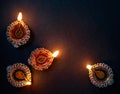 Colorful Diya lamp on floor